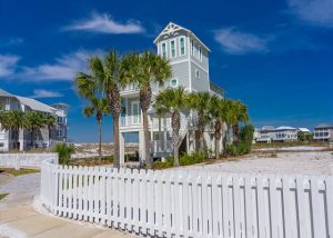 Destin home surrounded by palm trees
