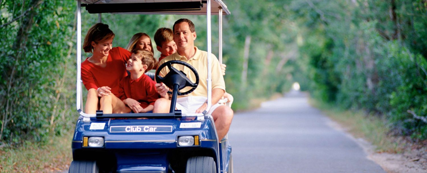 Family in a golf cart on Destin